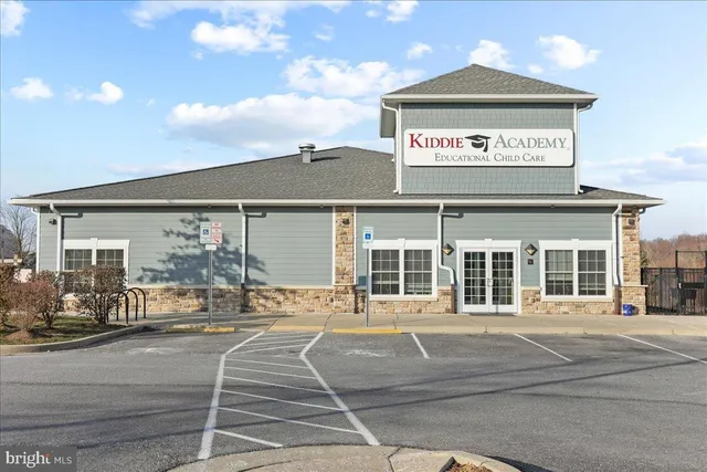 a backyard of a house with portable swimming pool and outdoor seating