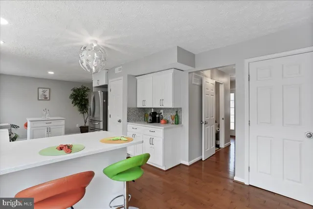 a very nice looking dining room with a table and chairs