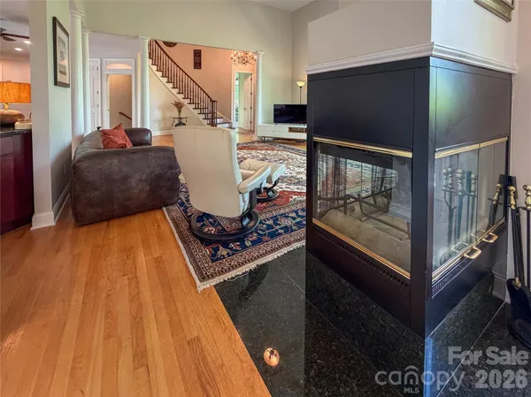 a spacious bedroom with a bed a dresser and a window