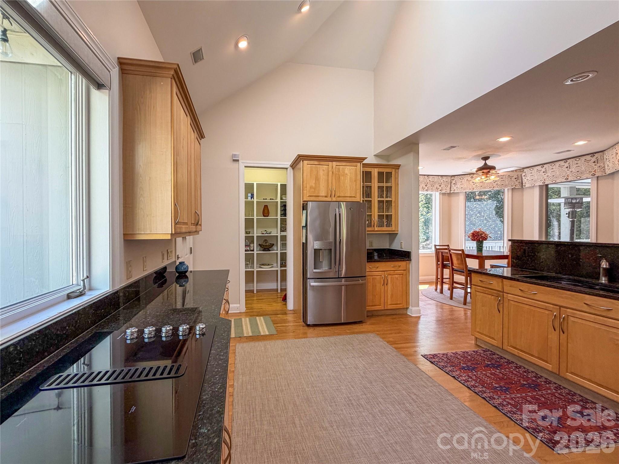 556 Quail Ridge Boulevard Lake Lure, NC 28746 - Photo 15 of 48 a kitchen with stainless steel appliances granite countertop a refrigerator and stove