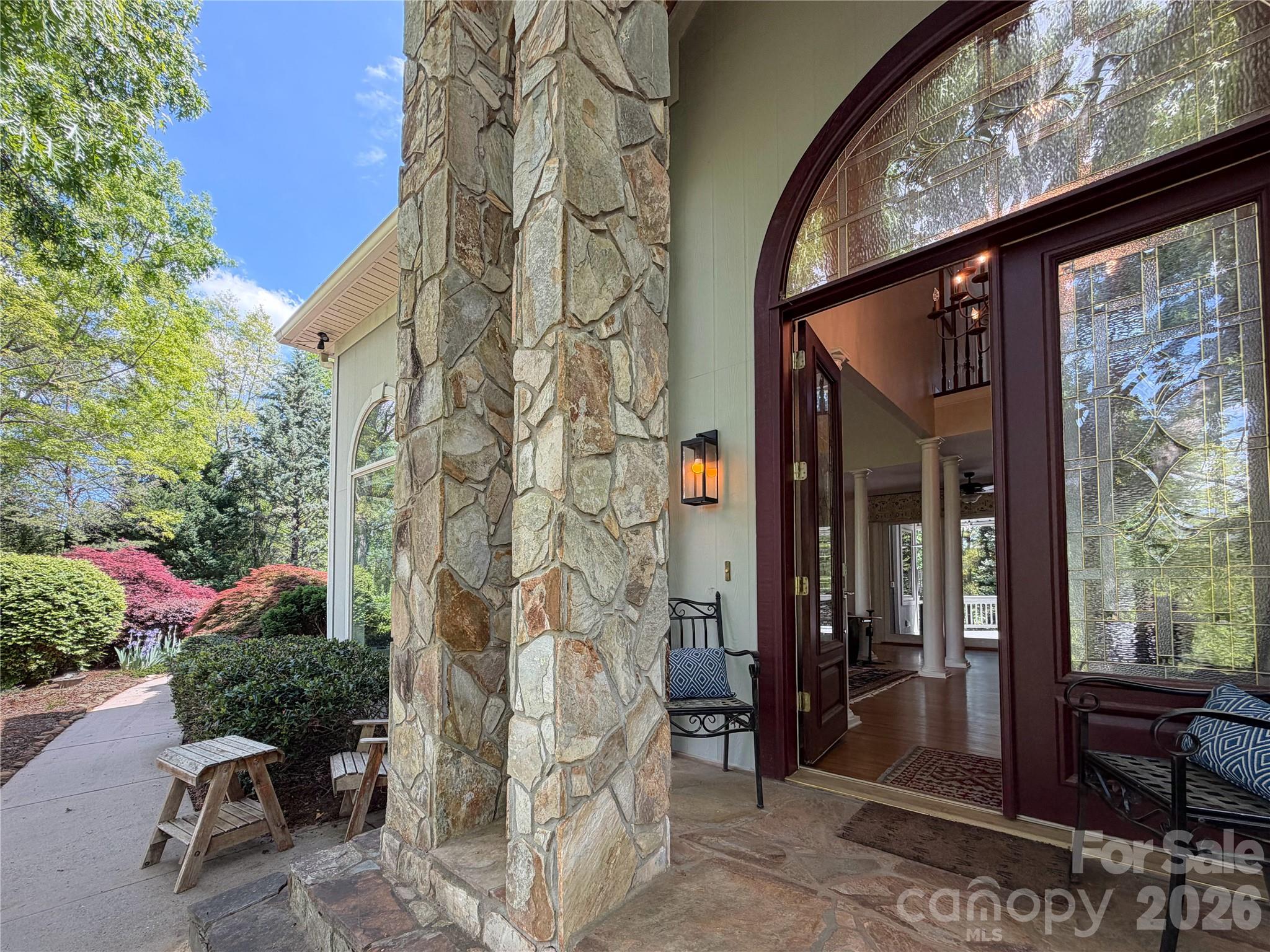 556 Quail Ridge Boulevard Lake Lure, NC 28746 - Photo 6 of 48 a backyard of a house with outdoor seating