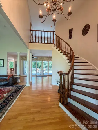a kitchen with stainless steel appliances granite countertop a stove top oven a sink and a refrigerator