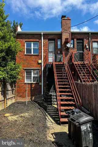a front view of a house with stairs