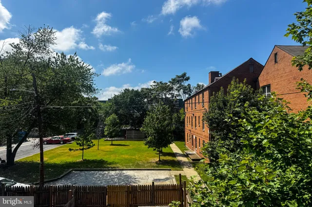 a view of a backyard with swimming pool