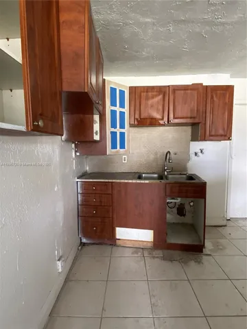 a kitchen with a cabinets and counter space