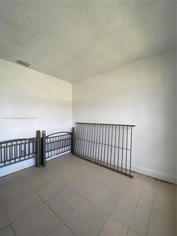 a bathroom with a toilet and a mirror