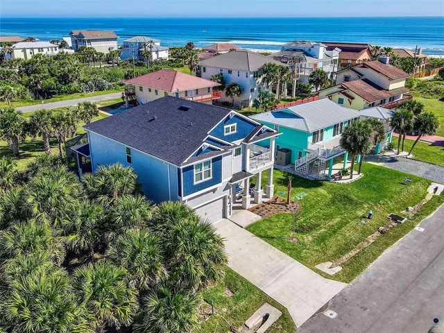 an aerial view of a house with a garden