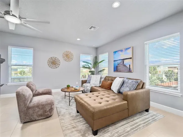 a living room with furniture and a large window