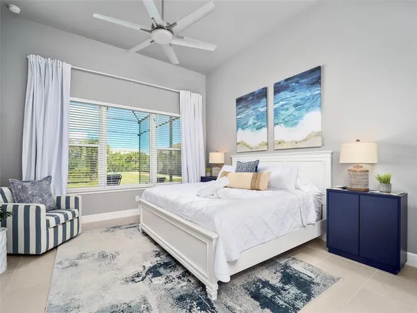 a bedroom with a large bed and a window