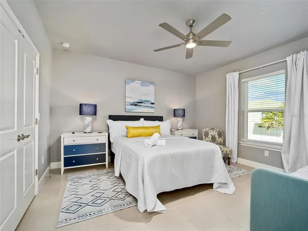 a bedroom with a bed and window