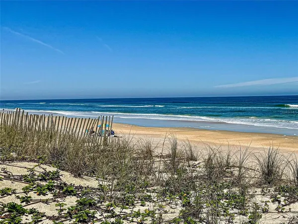 a view of a water fountain in front of a house