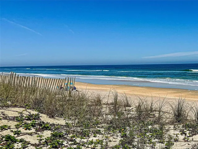 a view of a water fountain in front of a house