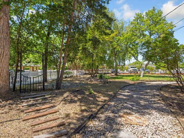 12825 South Fort Street Draper, UT 84020 - Photo 31 of 52 Expansive natural landscaping featuring mature trees and a gravel pathway