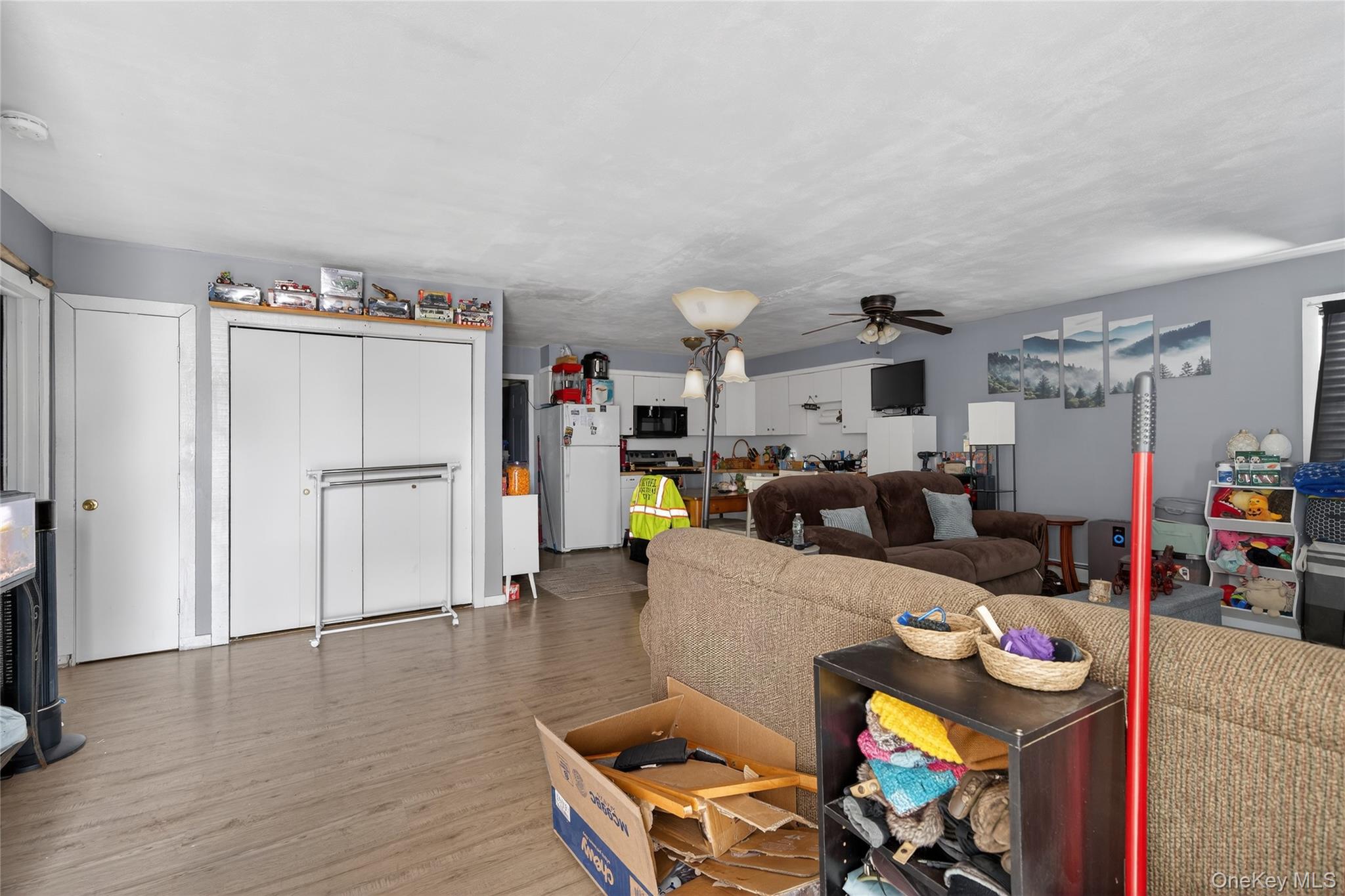 282 West Shore Road Bethel, NY 12783 - Photo 14 of 32 a living room with furniture and a wooden floor