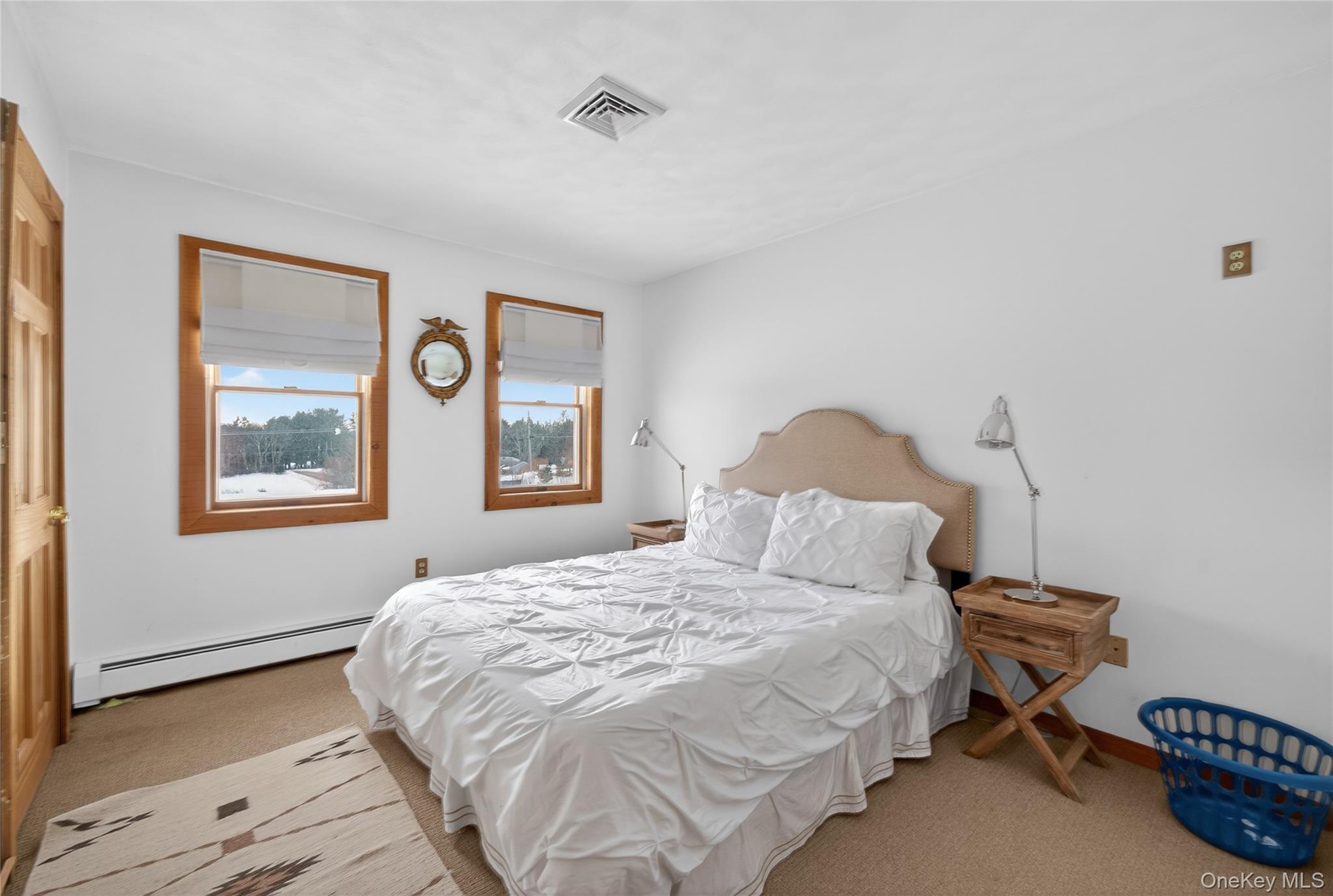 282 West Shore Road Bethel, NY 12783 - Photo 10 of 32 a bedroom with a bed and a window