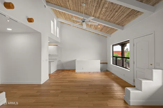 a view of an empty room with a window