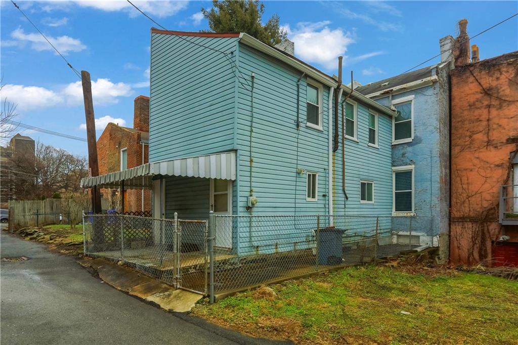 116 Hemlock Street Pittsburgh, PA 15212 - Photo 32 of 38 front view of a house with a yard