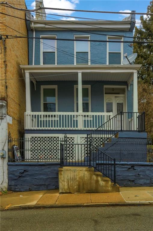 116 Hemlock Street Pittsburgh, PA 15212 - Photo 35 of 38 a view of a brick house with large windows
