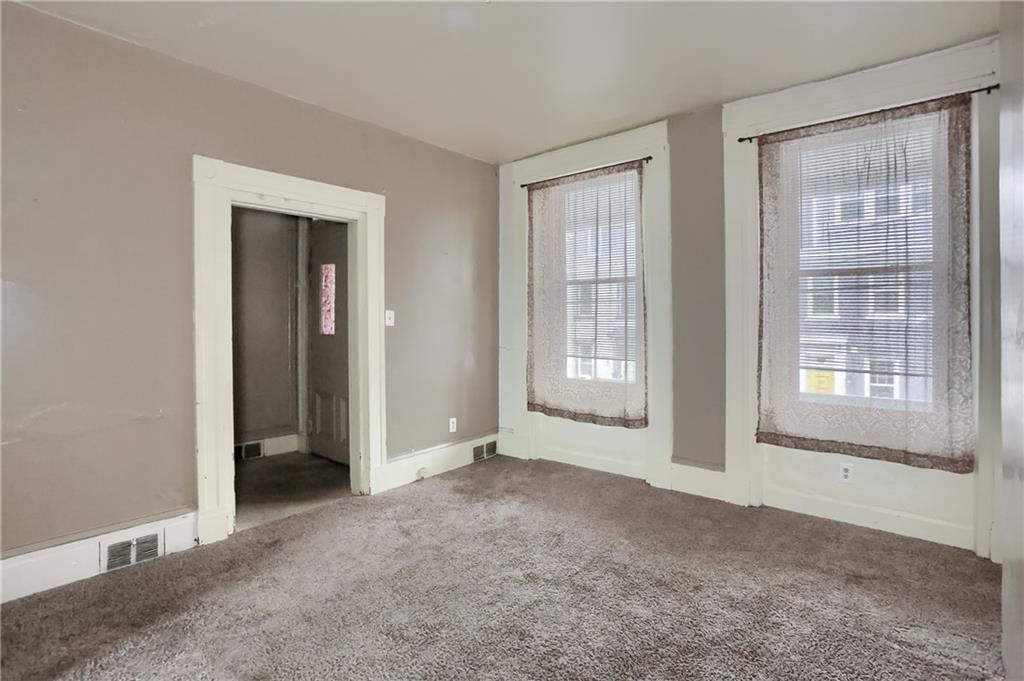 116 Hemlock Street Pittsburgh, PA 15212 - Photo 6 of 38 a view of an empty room with a window