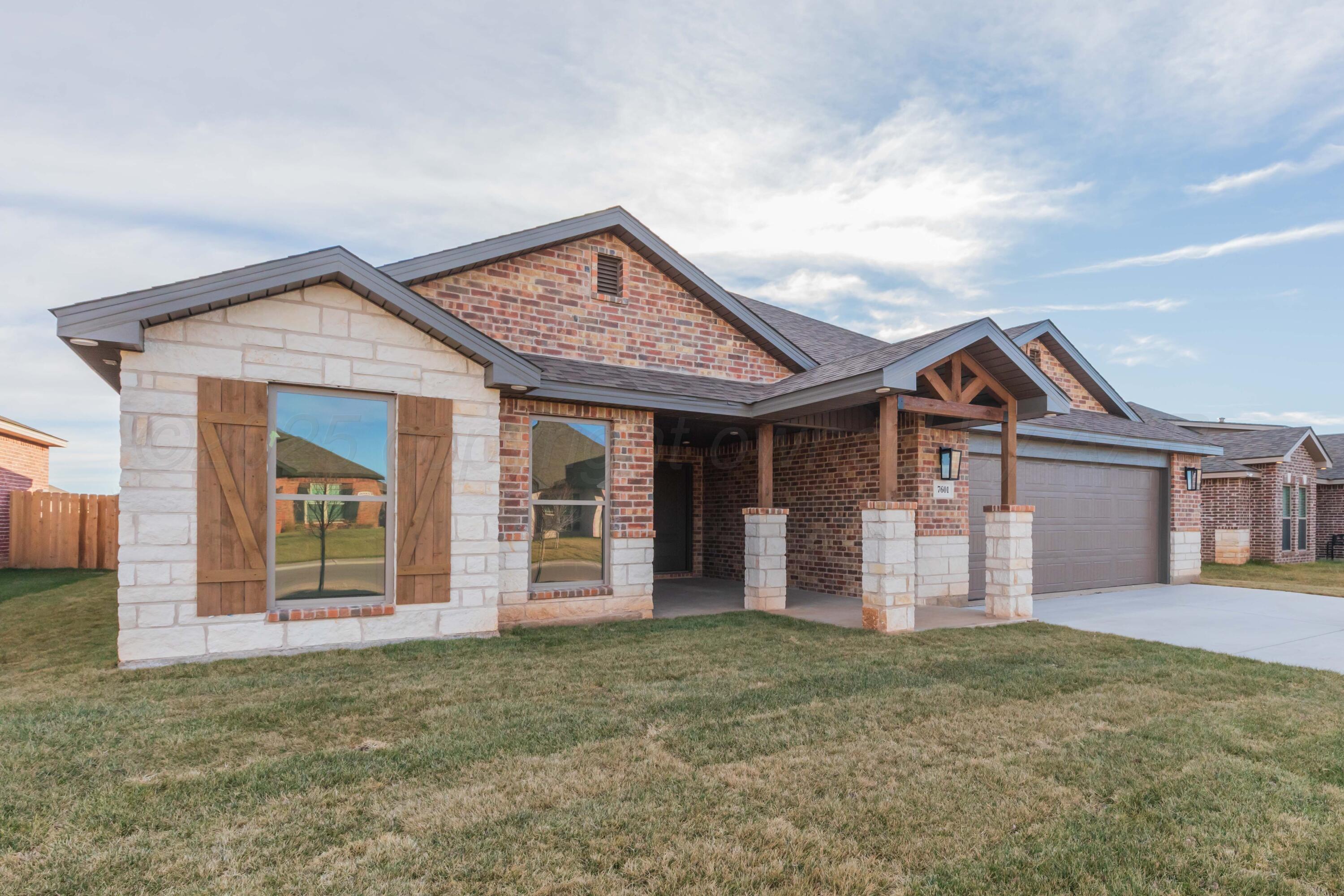 7601 Castleman Road Amarillo, TX 79119 - Photo 2 of 25 front view of a house with a dry yard