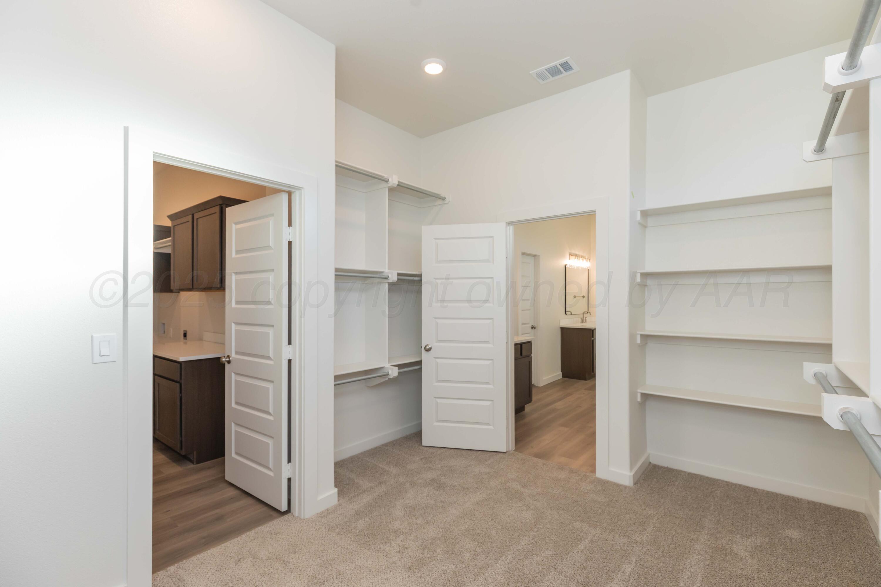 7601 Castleman Road Amarillo, TX 79119 - Photo 22 of 25 a view of walk in closet with empty racks