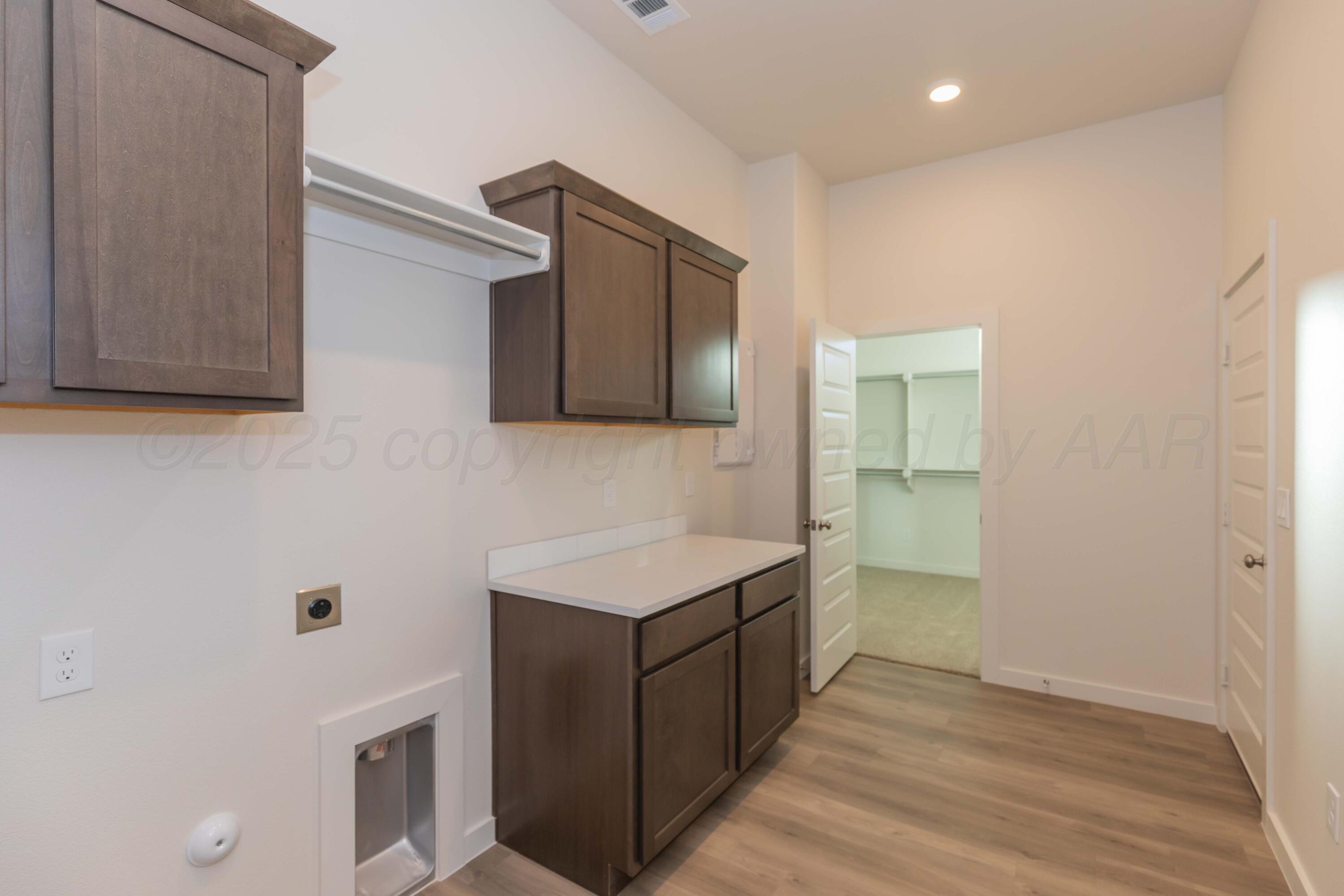 7601 Castleman Road Amarillo, TX 79119 - Photo 24 of 25 a kitchen with a sink and cabinets