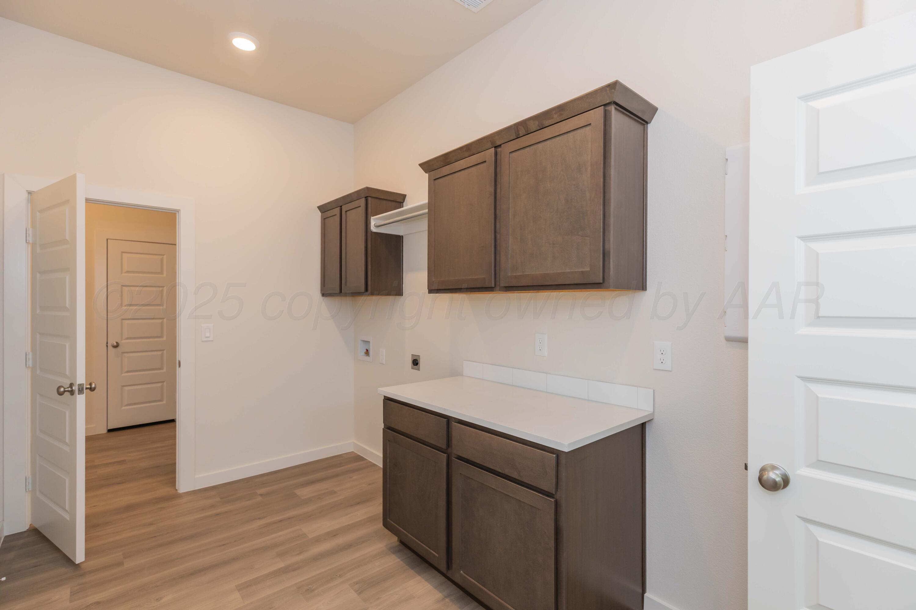 7601 Castleman Road Amarillo, TX 79119 - Photo 25 of 25 a bathroom with a sink and a mirror