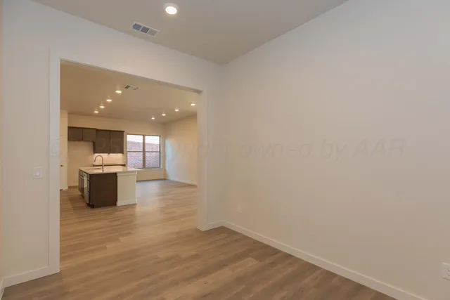 a view of a kitchen with a sink and a stove top oven