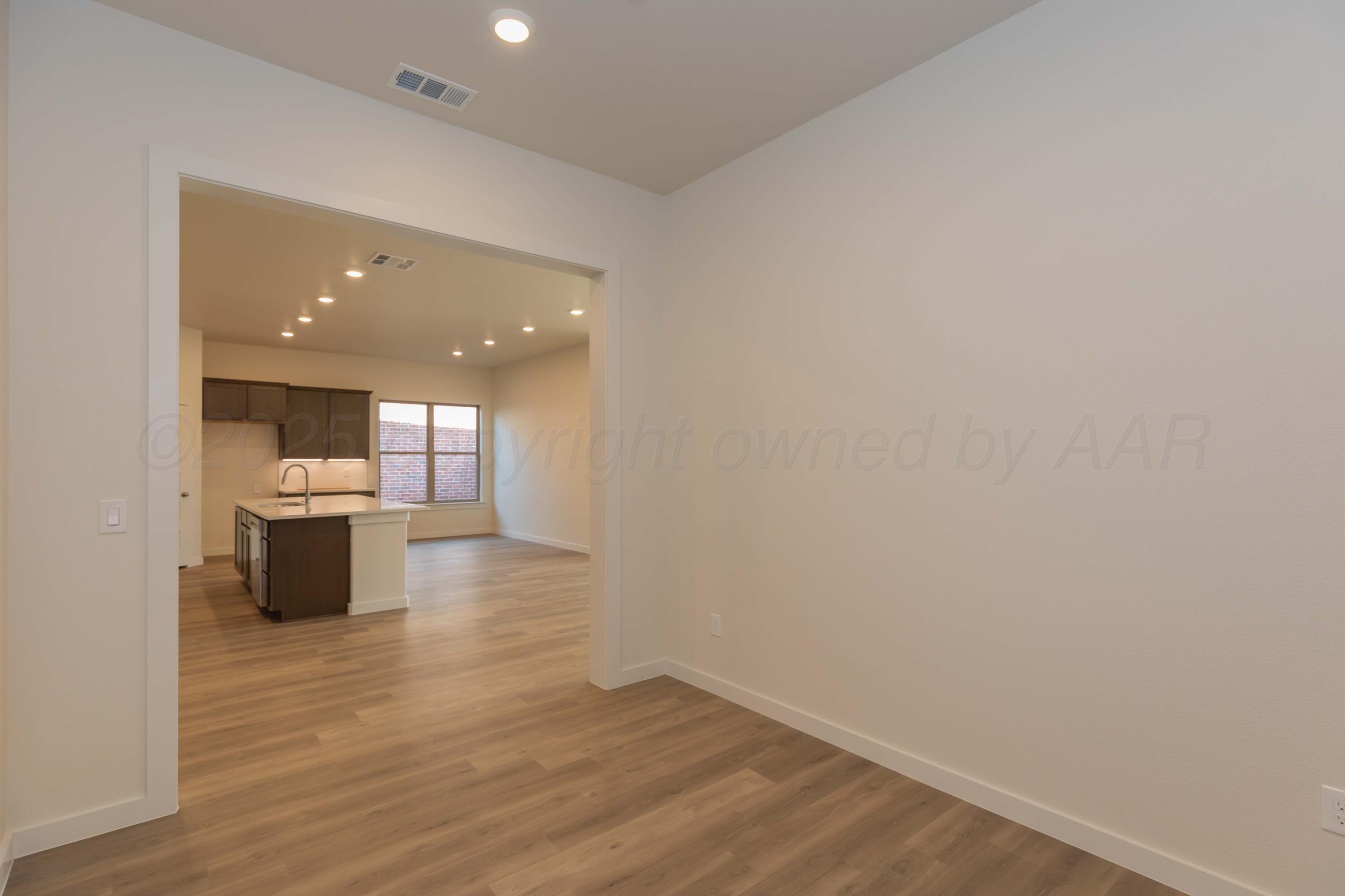 7601 Castleman Road Amarillo, TX 79119 - Photo 8 of 25 a view of a kitchen with a sink and a stove top oven