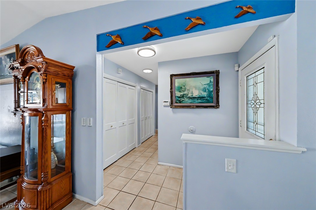 3107 Trueno Road Henderson, NV 89014 - Photo 9 of 37 A well-lit entry hall with tiled flooring and ample storage welcomes all who enter.