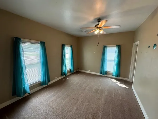 a view of a bathroom from a hallway