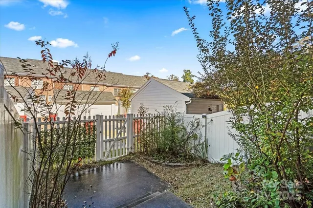 a view of a house with a yard and garden