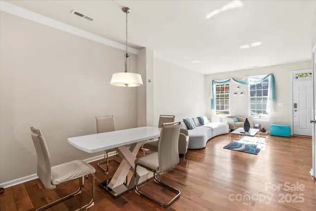 a view of a livingroom with furniture window and wooden floor