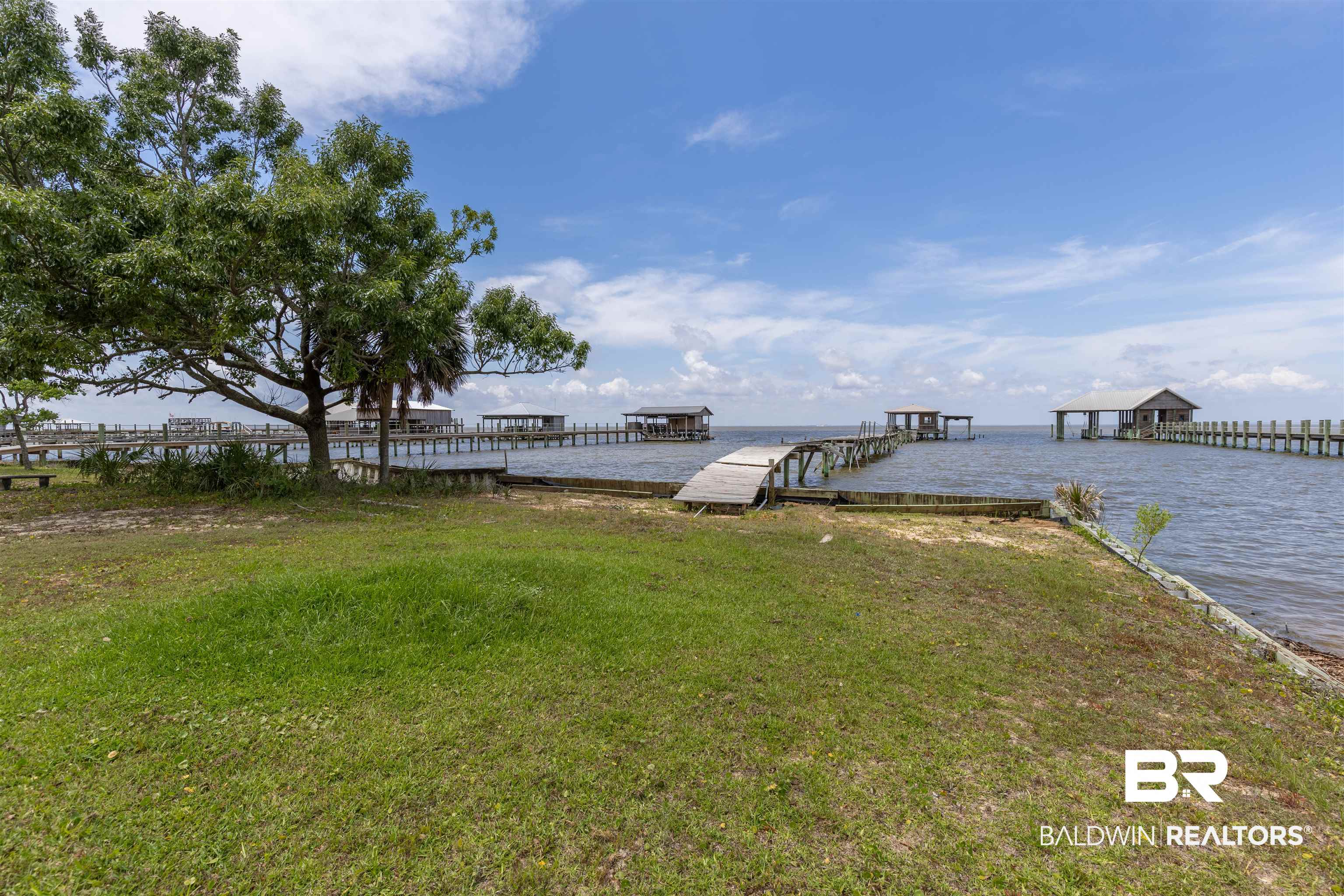 724 Mobile South Street Fairhope, AL 36532 - Photo 8 of 38 Dock area with a yard and a water view