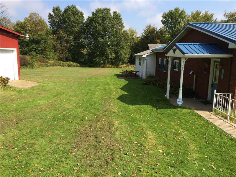 148 Baker Road Greenville, PA 16125 - Photo 6 of 6 Yard/Garden. Finished workshop with a 1 car garage.