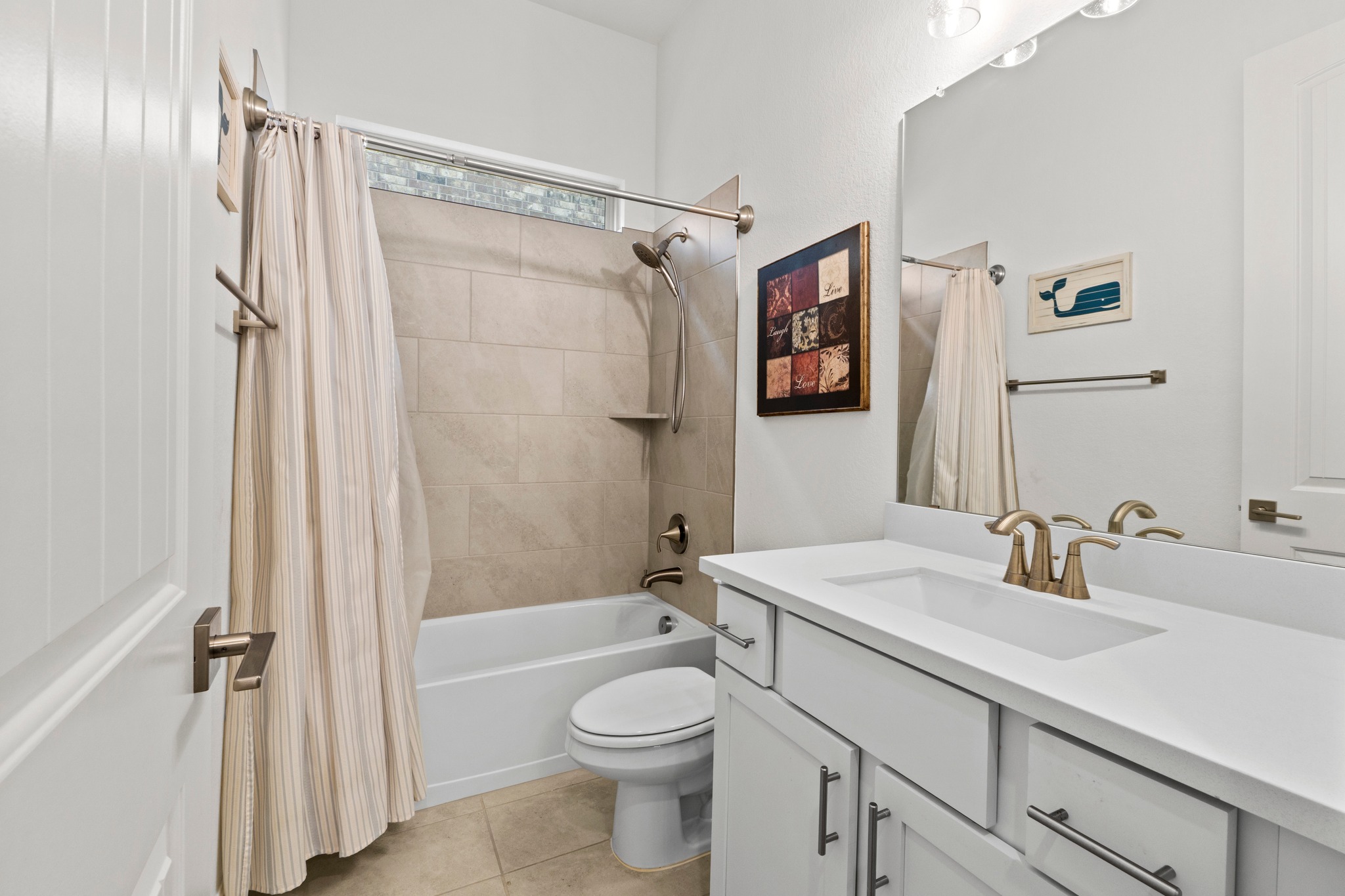 271 Tubman Drive Kyle, TX 78640 - Photo 22 of 40 a bathroom with a sink a toilet and shower