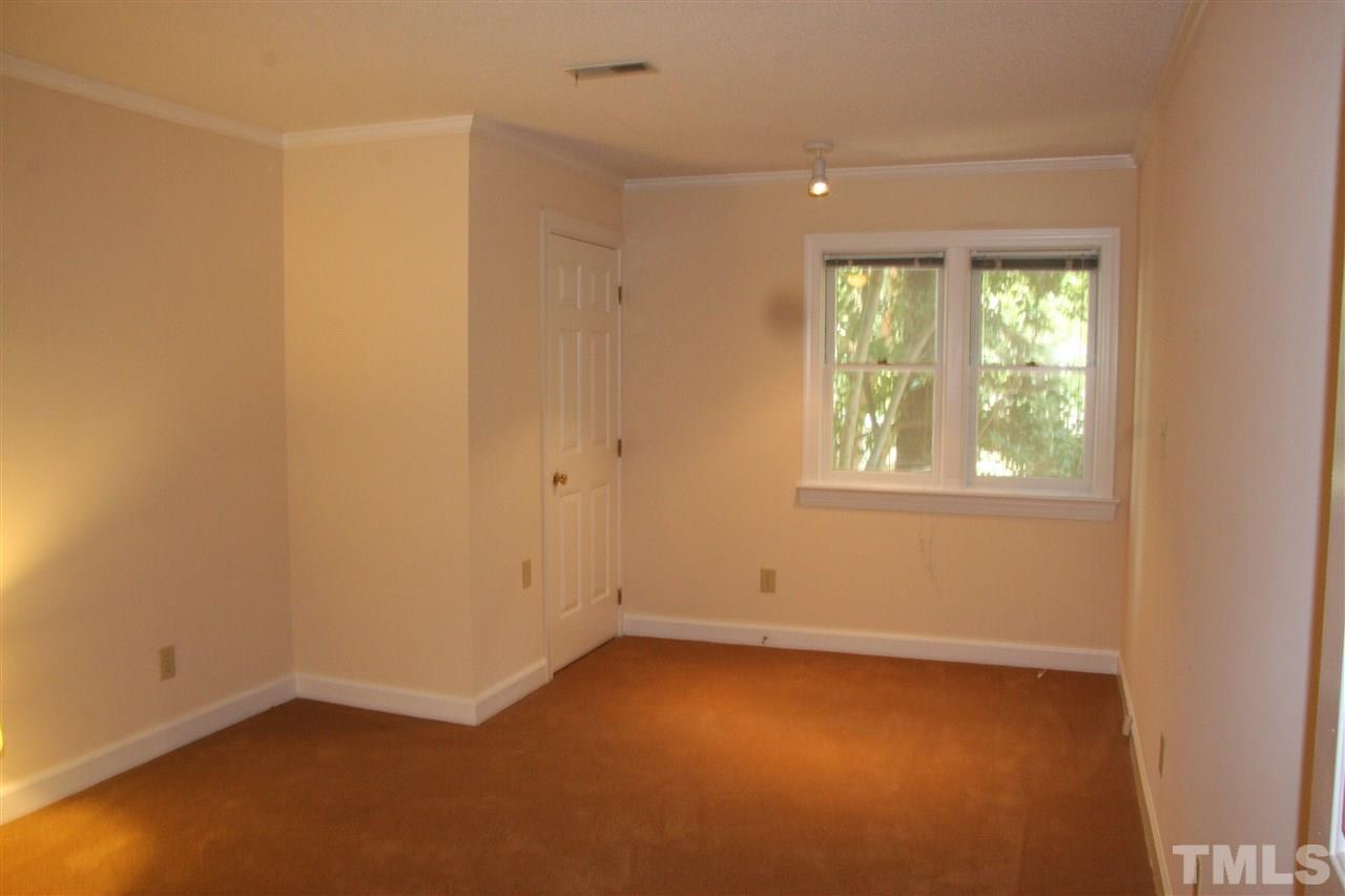 7040 Sandy Forks Road, Unit 105 Raleigh, NC 27615 - Photo 13 of 21 an empty room with a window