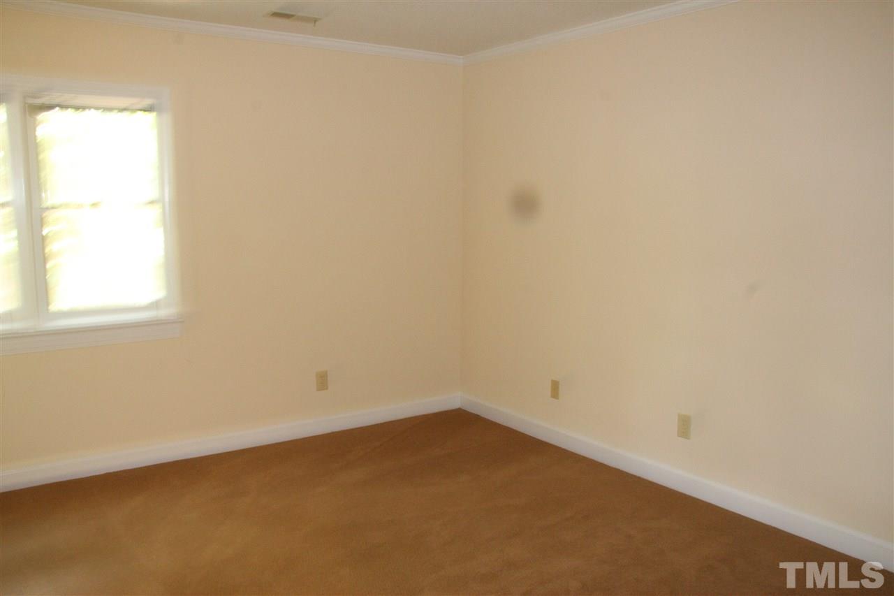 7040 Sandy Forks Road, Unit 105 Raleigh, NC 27615 - Photo 14 of 21 an empty room with a window
