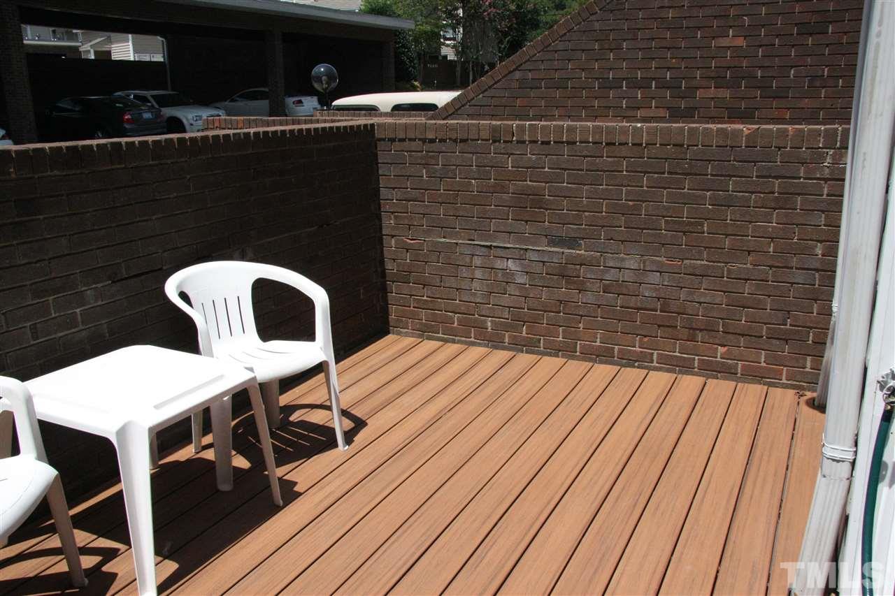 7040 Sandy Forks Road, Unit 105 Raleigh, NC 27615 - Photo 17 of 21 a balcony with table and chairs