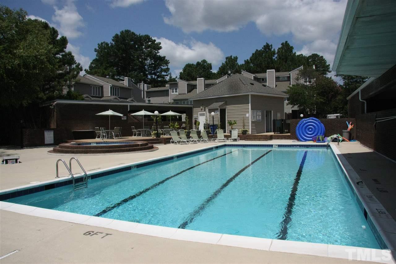 7040 Sandy Forks Road, Unit 105 Raleigh, NC 27615 - Photo 19 of 21 a view of a swimming pool with a patio
