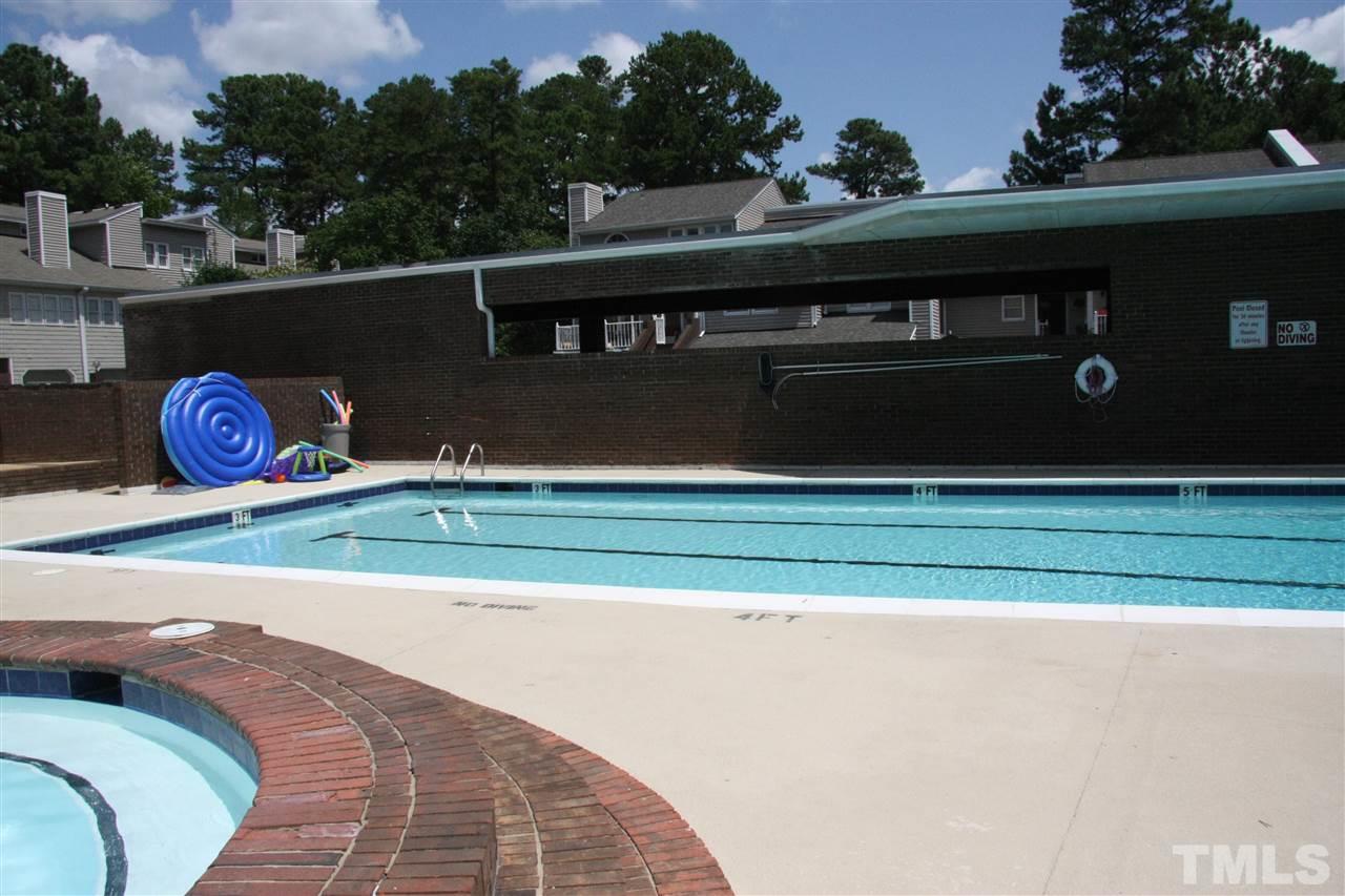 7040 Sandy Forks Road, Unit 105 Raleigh, NC 27615 - Photo 21 of 21 a view of swimming pool with a yard
