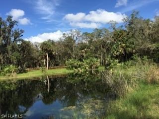 18900 South River Road Alva, FL 33920 - Photo 13 of 15 a view of a lake with green space