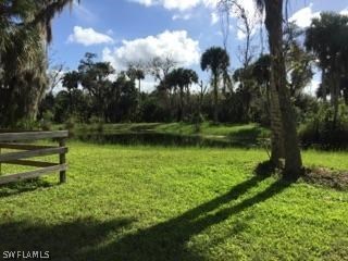 18900 South River Road Alva, FL 33920 - Photo 14 of 15 a view of a golf course with a lake