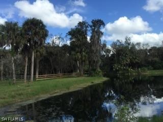 18900 South River Road Alva, FL 33920 - Photo 15 of 15 a view of a golf course with a lake