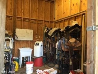 18900 South River Road Alva, FL 33920 - Photo 5 of 15 a view of walk in closet with clothes and shoes