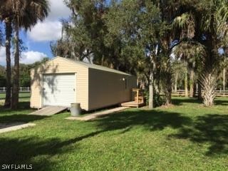 18900 South River Road Alva, FL 33920 - Photo 7 of 15 a view of a back yard of the house