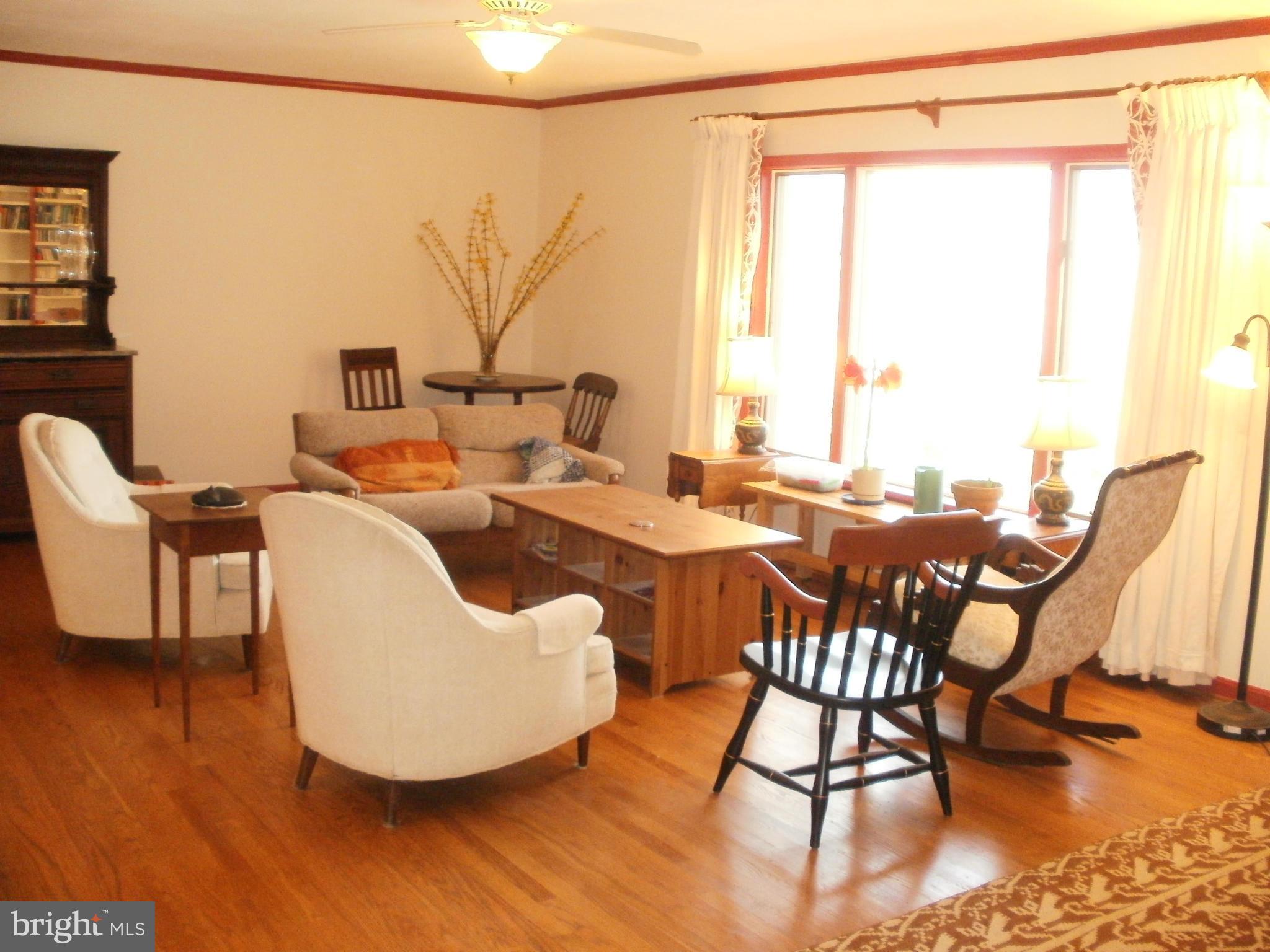 17957 Trossbach Road Dameron, MD 20628 - Photo 7 of 30 a living room with furniture and a large window