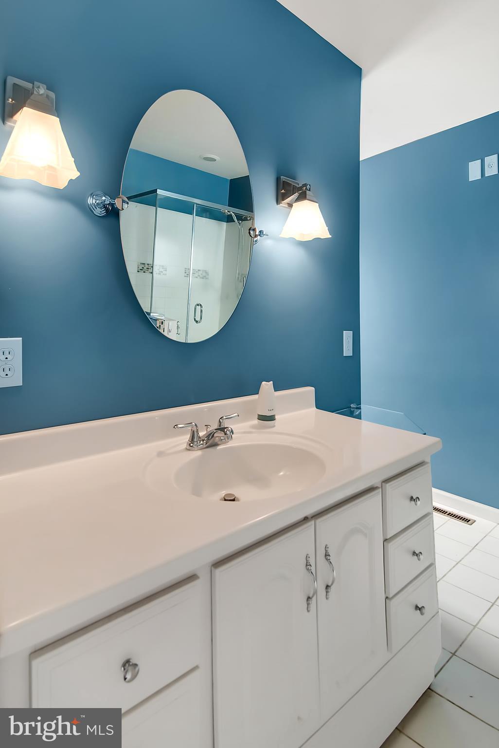 1211 Hillside Road Pasadena, MD 21122 - Photo 15 of 24 a bathroom with a sink mirror and vanity