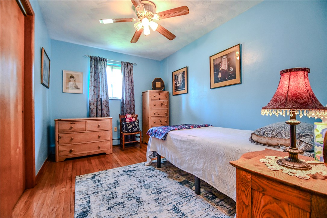 10833 Kendig Road Medway, OH 45341 - Photo 29 of 46 Bright and airy bedroom features hardwood floors and a ceiling fan for comfort.