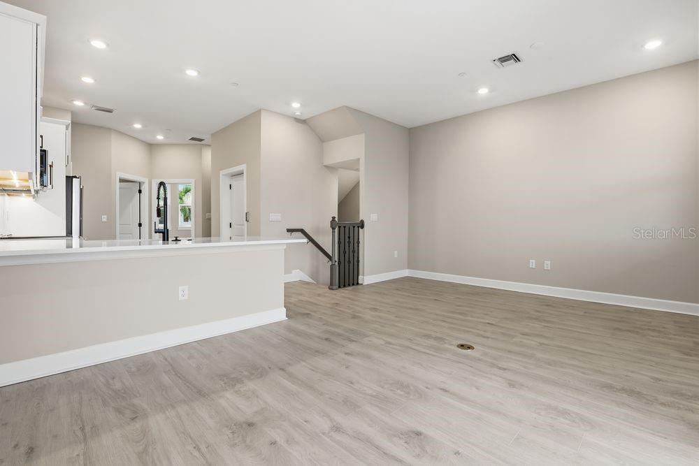 1624 Compass Pointe Court, Unit 203 Punta Gorda, FL 33950 - Photo 11 of 44 a view of a kitchen with a sink and a refrigerator
